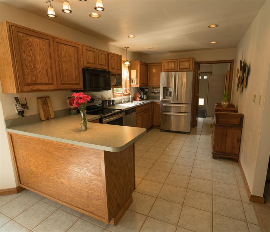 244 Walker Road Apollo, PA 15613 - Photo 7 of 25 Custom-made Solid Red Oak cabinetry, Stainless Steel appliances and recessed lighting will be sure to make the cook in the family extremely happy!