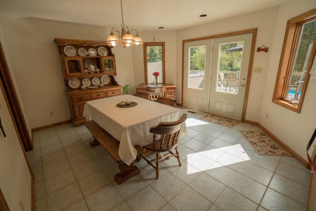 244 Walker Road Apollo, PA 15613 - Photo 9 of 25 The kitchen is open to this fantastic dining room that is just pouring in with natural light.