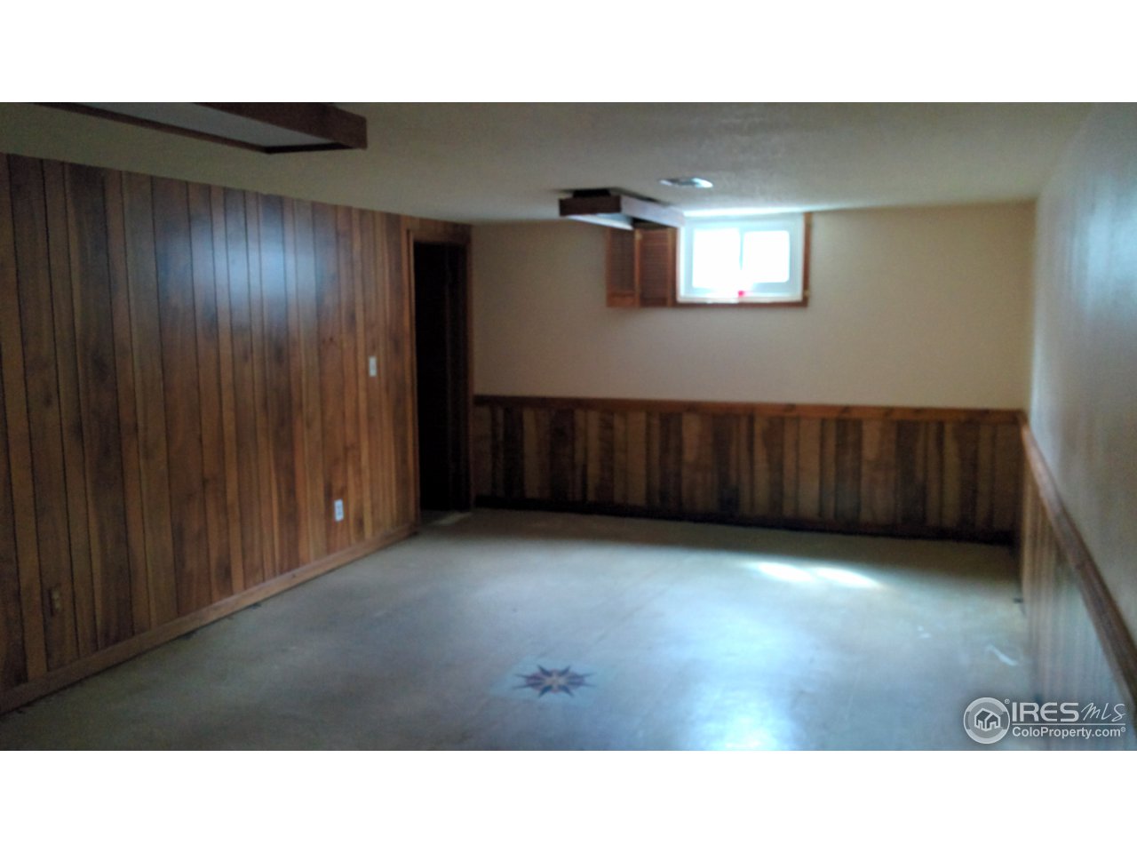 2478 25th Street Road Greeley, CO 80634 - Photo 12 of 19 a open hall with wooden floor