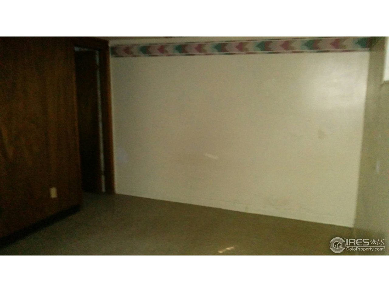 2478 25th Street Road Greeley, CO 80634 - Photo 14 of 19 a open area with wooden floor