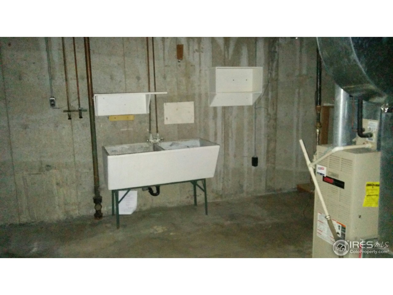 2478 25th Street Road Greeley, CO 80634 - Photo 16 of 19 a bathroom with a sink and a mirror