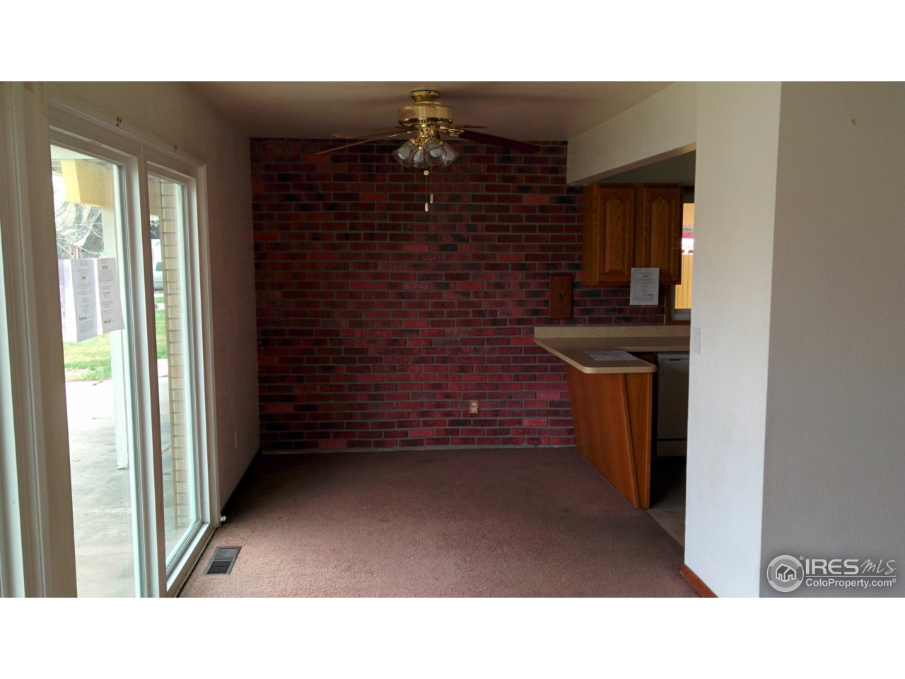 2478 25th Street Road Greeley, CO 80634 - Photo 4 of 19 a black and white photo of a living room