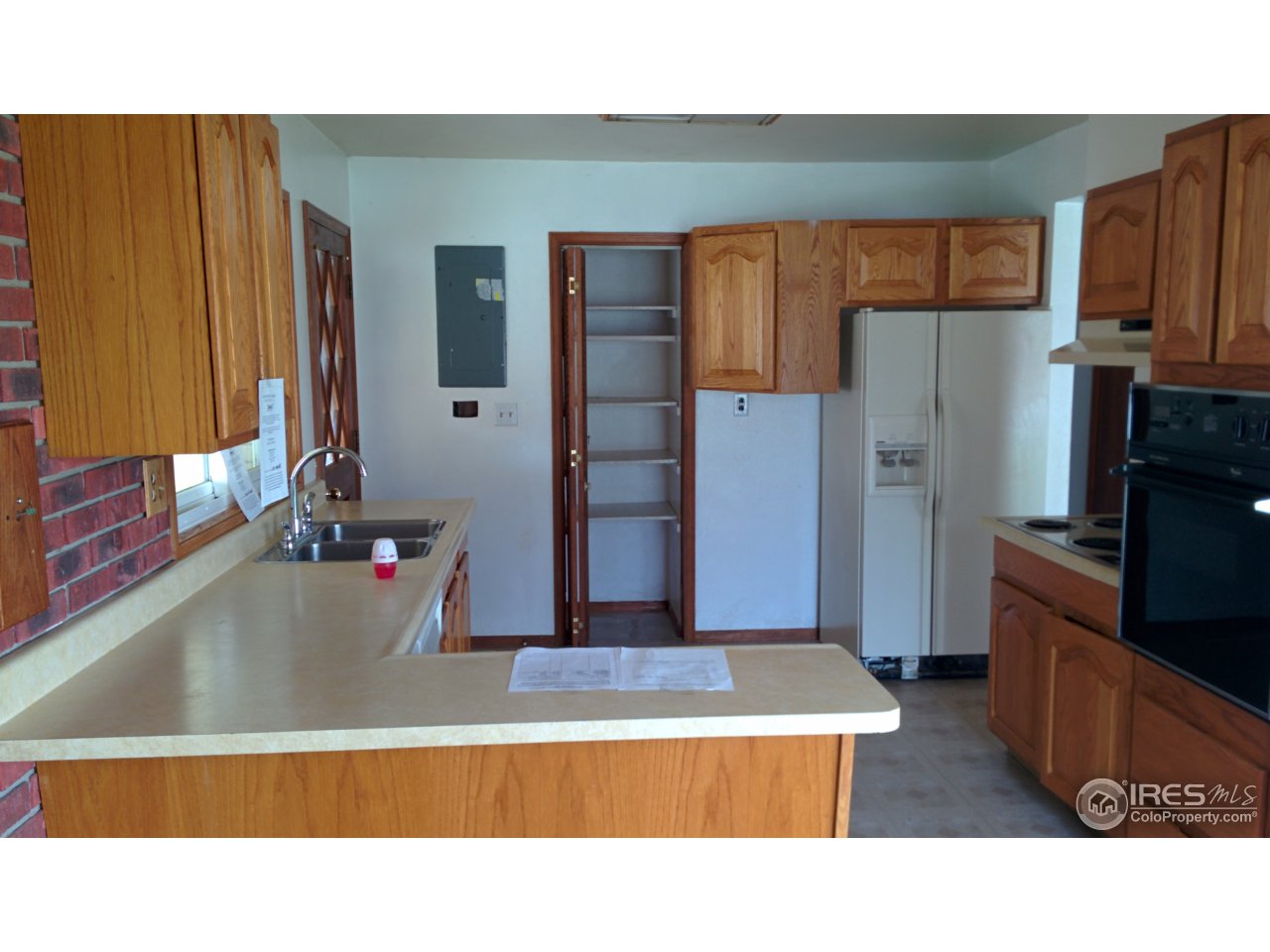 2478 25th Street Road Greeley, CO 80634 - Photo 5 of 19 a kitchen with stainless steel appliances kitchen island granite countertop a refrigerator and a sink