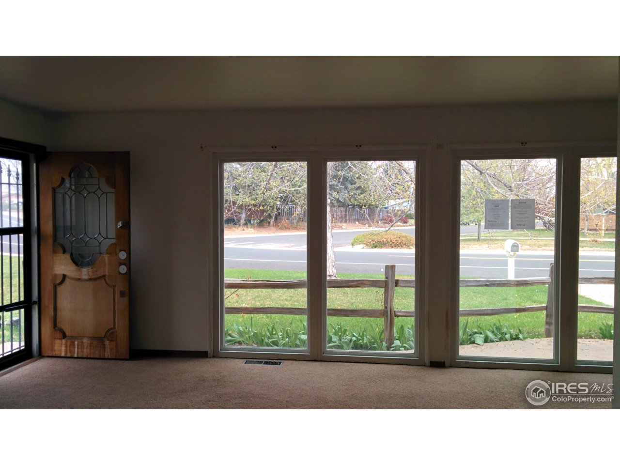 2478 25th Street Road Greeley, CO 80634 - Photo 6 of 19 a black and white photo of a living room