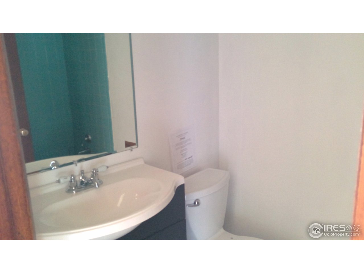 2478 25th Street Road Greeley, CO 80634 - Photo 7 of 19 a bathroom with a sink and a mirror