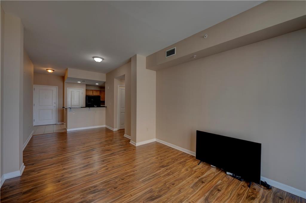 3040 Peachtree Road, Unit 813 Atlanta, GA 30305 - Photo 11 of 28 a view of empty room with wooden floor