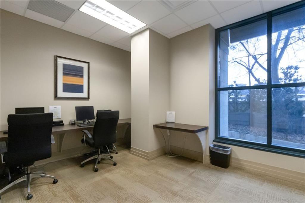 3040 Peachtree Road, Unit 813 Atlanta, GA 30305 - Photo 23 of 28 a view of a workspace with furniture and a window