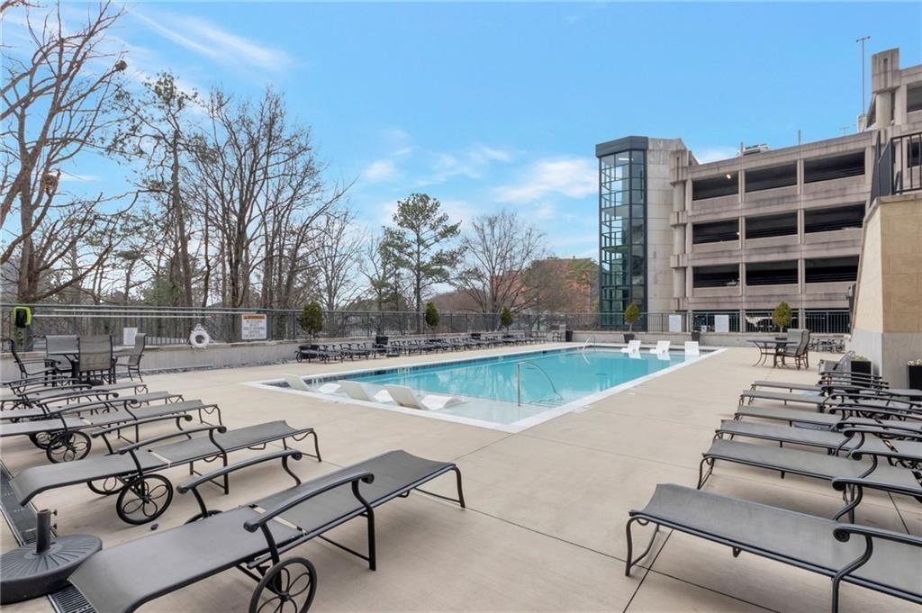 3040 Peachtree Road, Unit 813 Atlanta, GA 30305 - Photo 27 of 28 a view of swimming pool with outdoor seating and city view