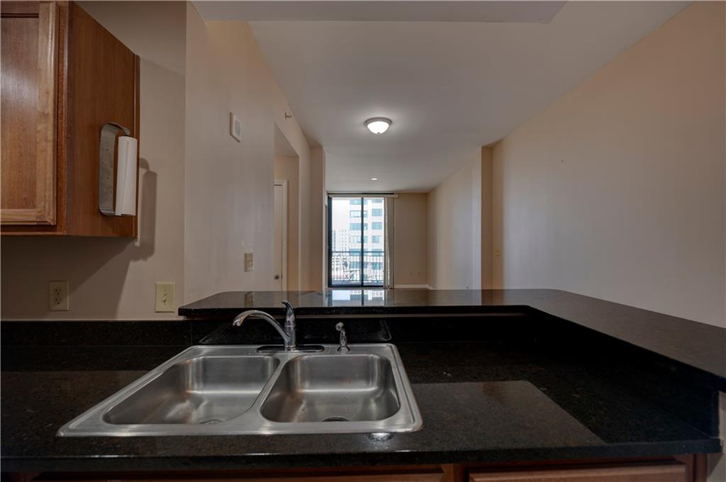 3040 Peachtree Road, Unit 813 Atlanta, GA 30305 - Photo 8 of 28 a bathroom with a sink and a mirror