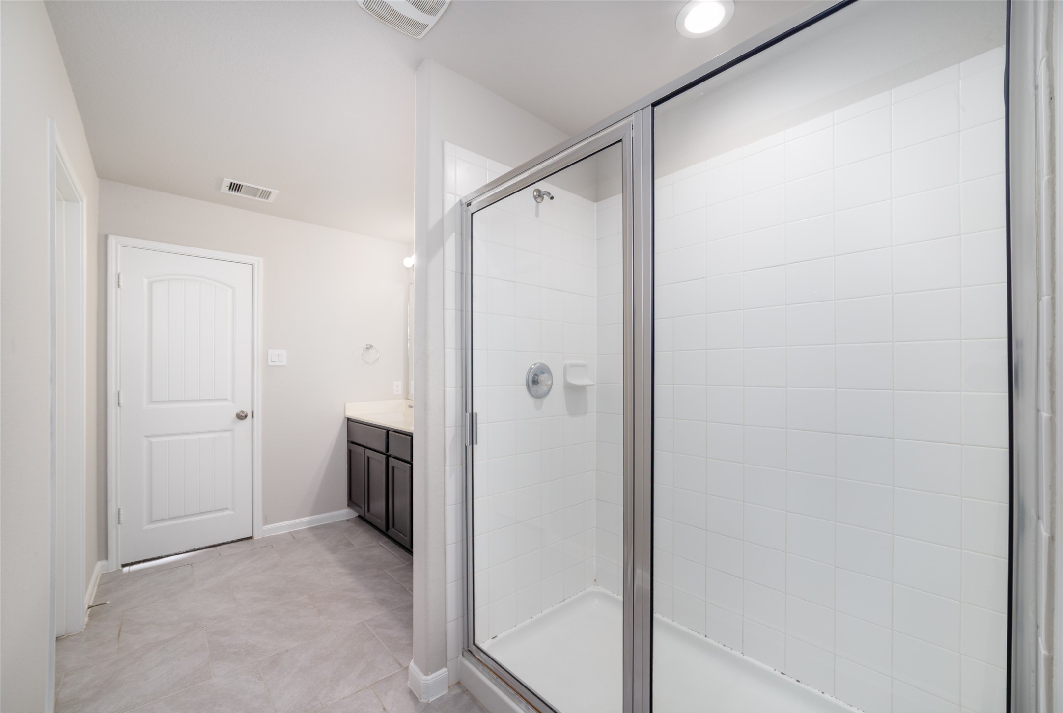 8307 Oakleaf Meadow Court Rosharon, TX 77583 - Photo 22 of 39 a bathroom with a shower and a glass door