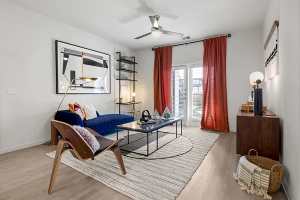 a living room with furniture and a window