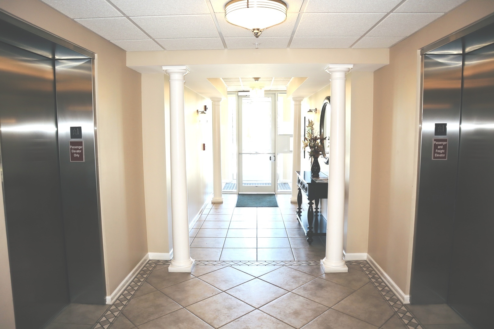 601 West Rand Road, Unit 315 Arlington Heights, IL 60004 - Photo 11 of 12 a bathroom with a glass door shower