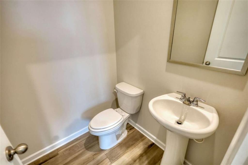 719 Sara Meadow Road Loganville, GA 30052 - Photo 22 of 74 a bathroom with a sink and a toilet