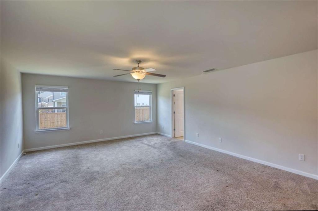 719 Sara Meadow Road Loganville, GA 30052 - Photo 37 of 74 a view of an empty room with a window