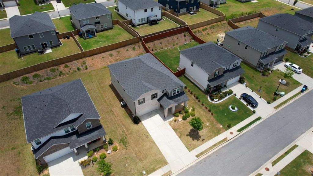 719 Sara Meadow Road Loganville, GA 30052 - Photo 67 of 74 an aerial view of a house with a swimming pool