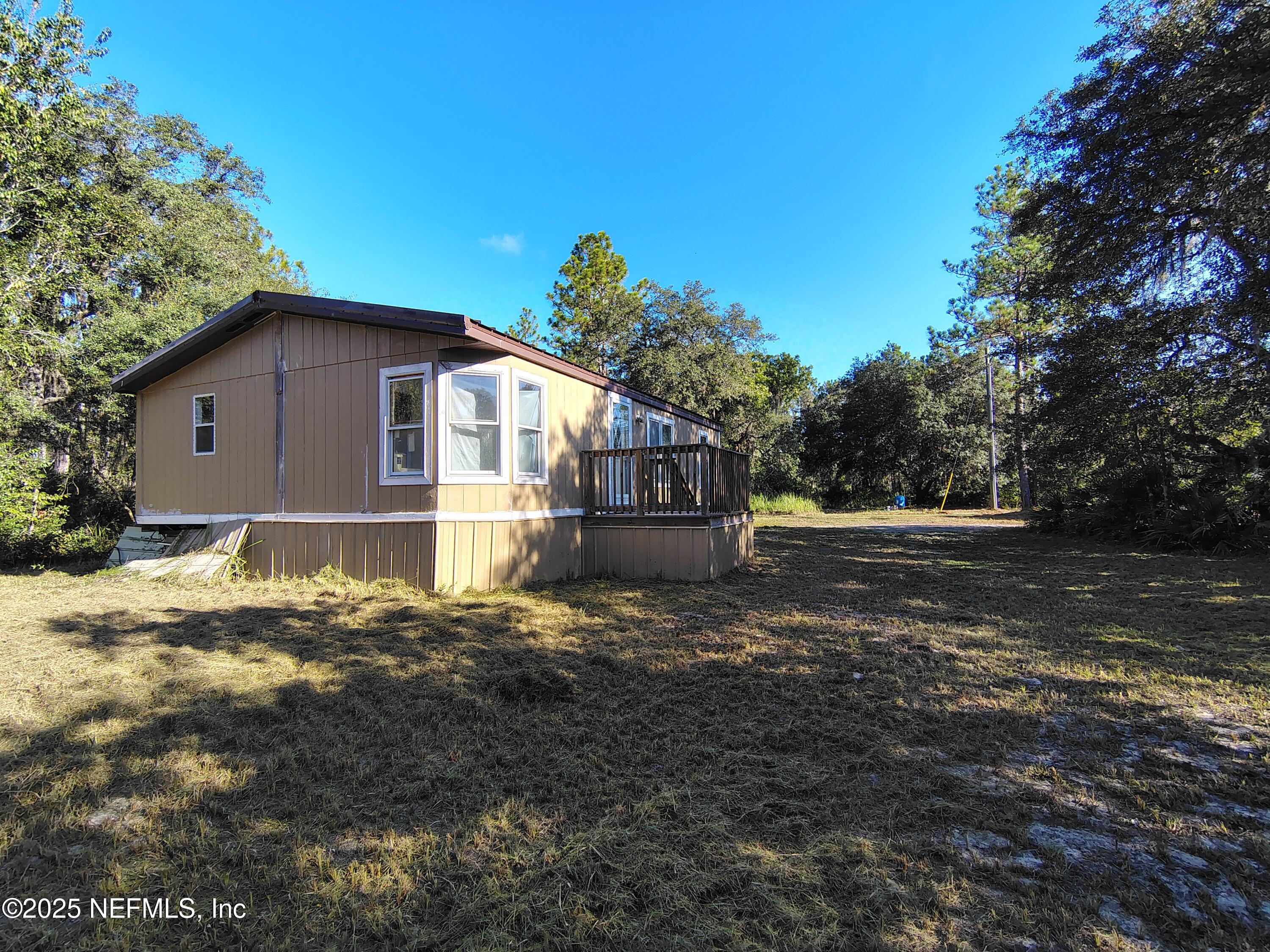 601 Hoover Road Interlachen, FL 32148 - Photo 2 of 33 a view of a house with a yard