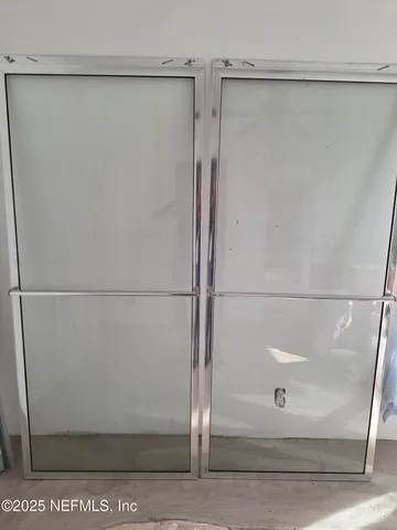 a bathroom with a glass shower door