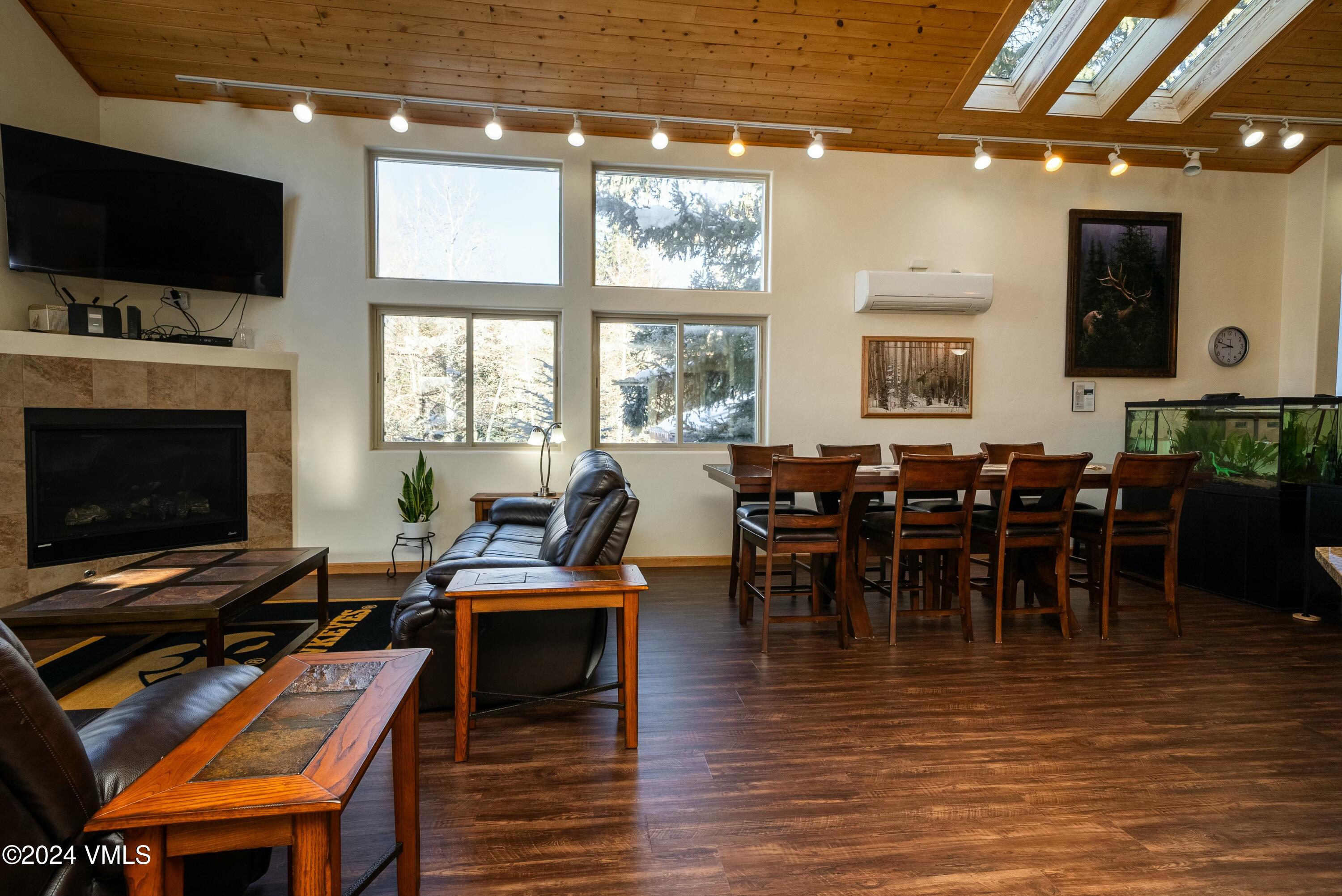 228-238 West Beaver Creek Boulevard, Unit A & B Avon, CO 81620 - Photo 14 of 72 a view of a dining room with furniture window and wooden floor