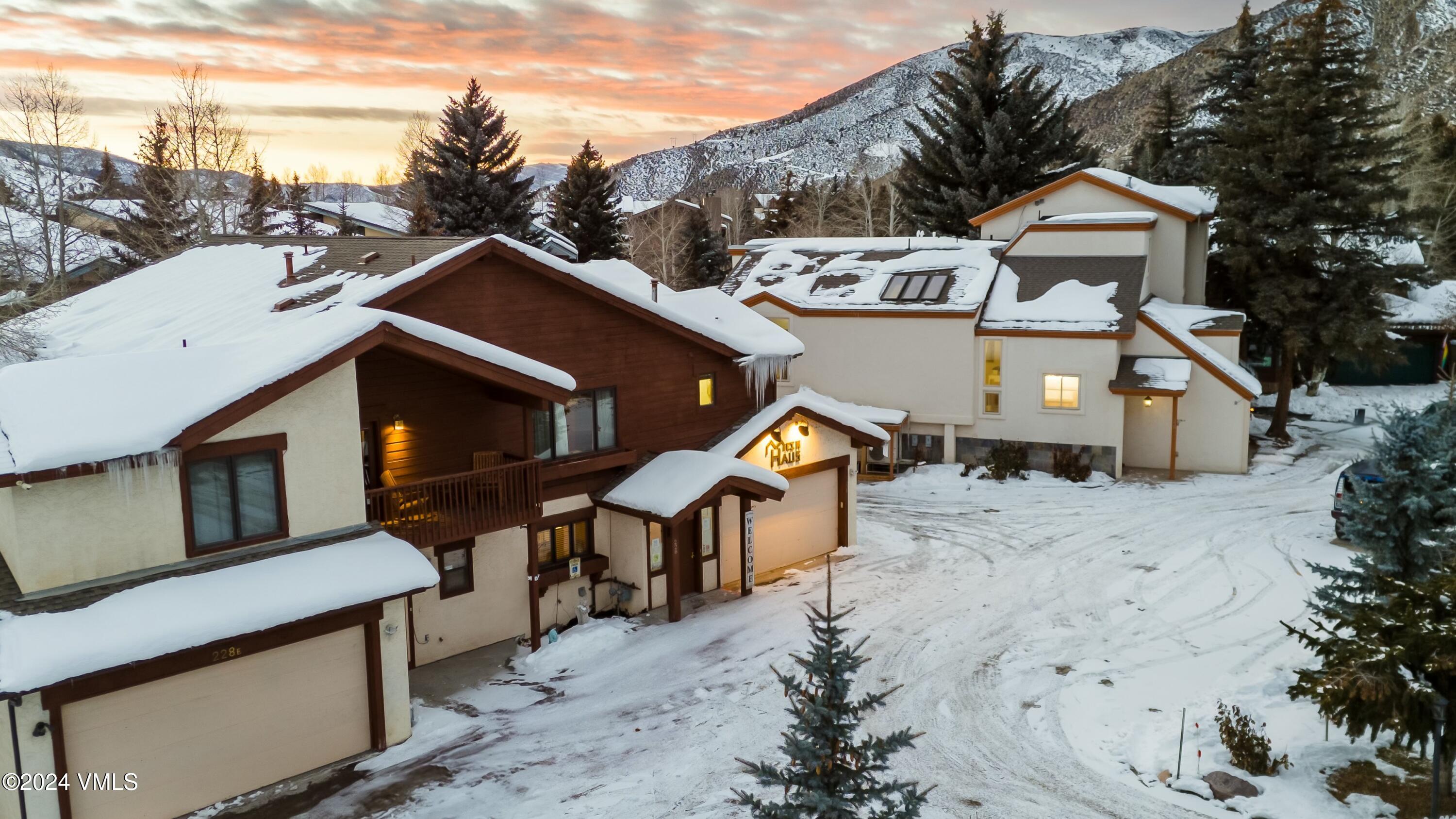 228-238 West Beaver Creek Boulevard, Unit A & B Avon, CO 81620 - Photo 33 of 72 a front view of a house with a yard
