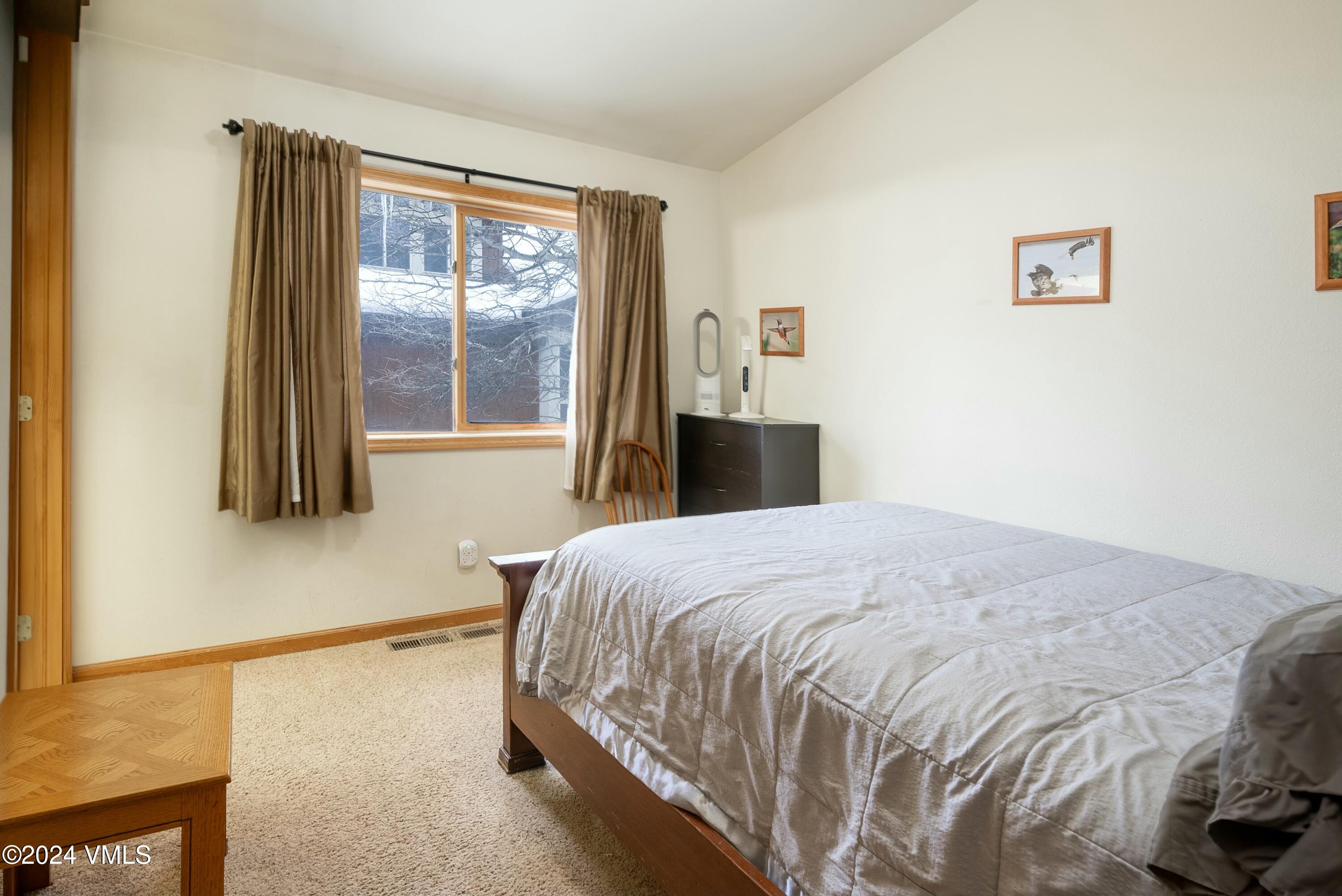 228-238 West Beaver Creek Boulevard, Unit A & B Avon, CO 81620 - Photo 70 of 72 a bedroom with a bed and a window