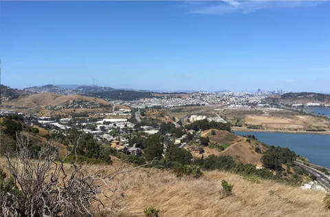 a view of mountain view with mountains in the background