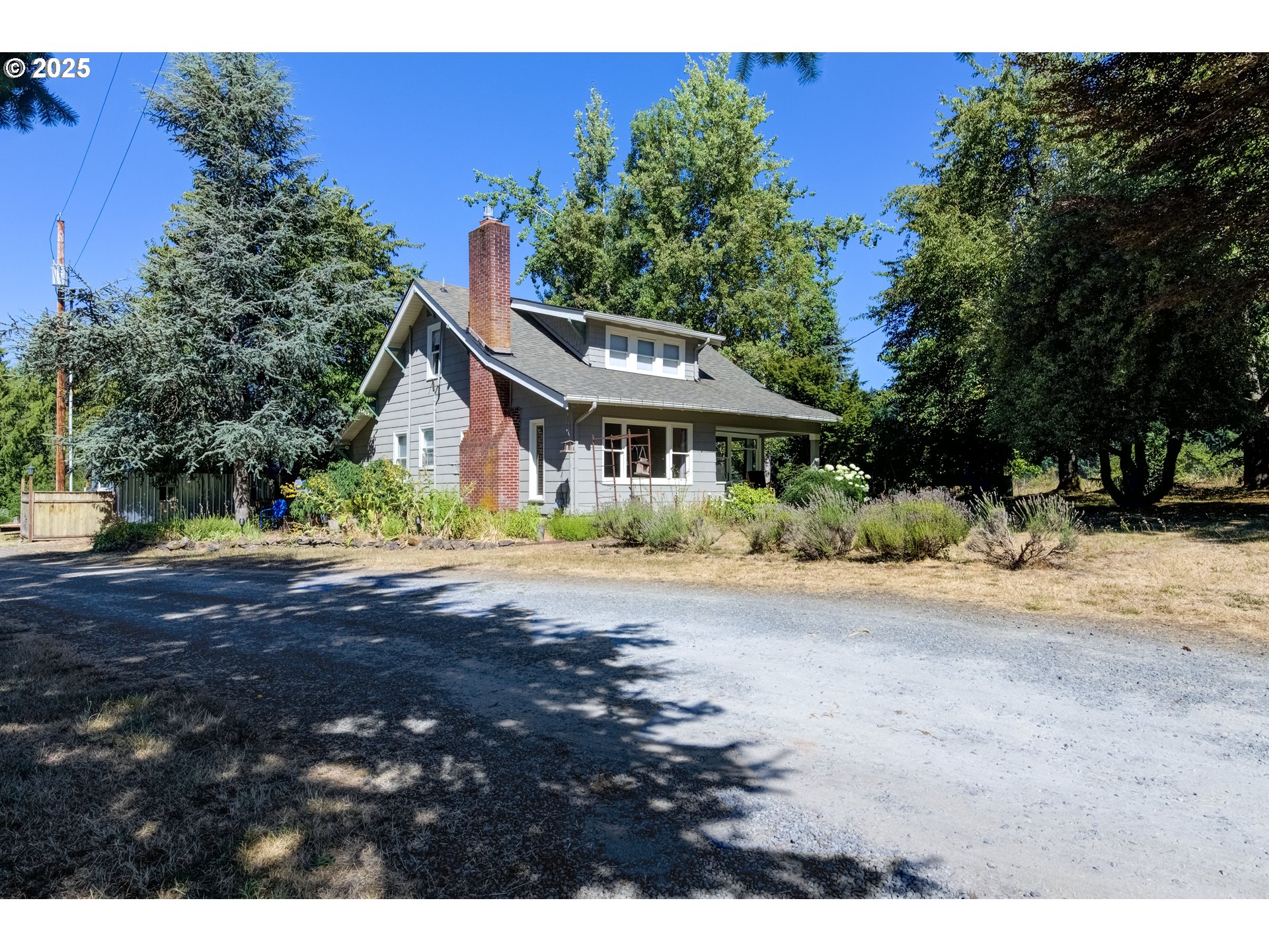 25113 South Ridge Road Beavercreek, OR 97004 - Photo 2 of 43 a view of a house with a yard