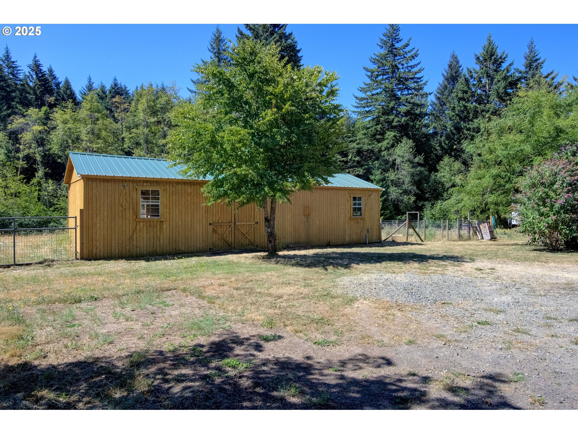 25113 South Ridge Road Beavercreek, OR 97004 - Photo 21 of 43 a backyard of a house with lots of green space
