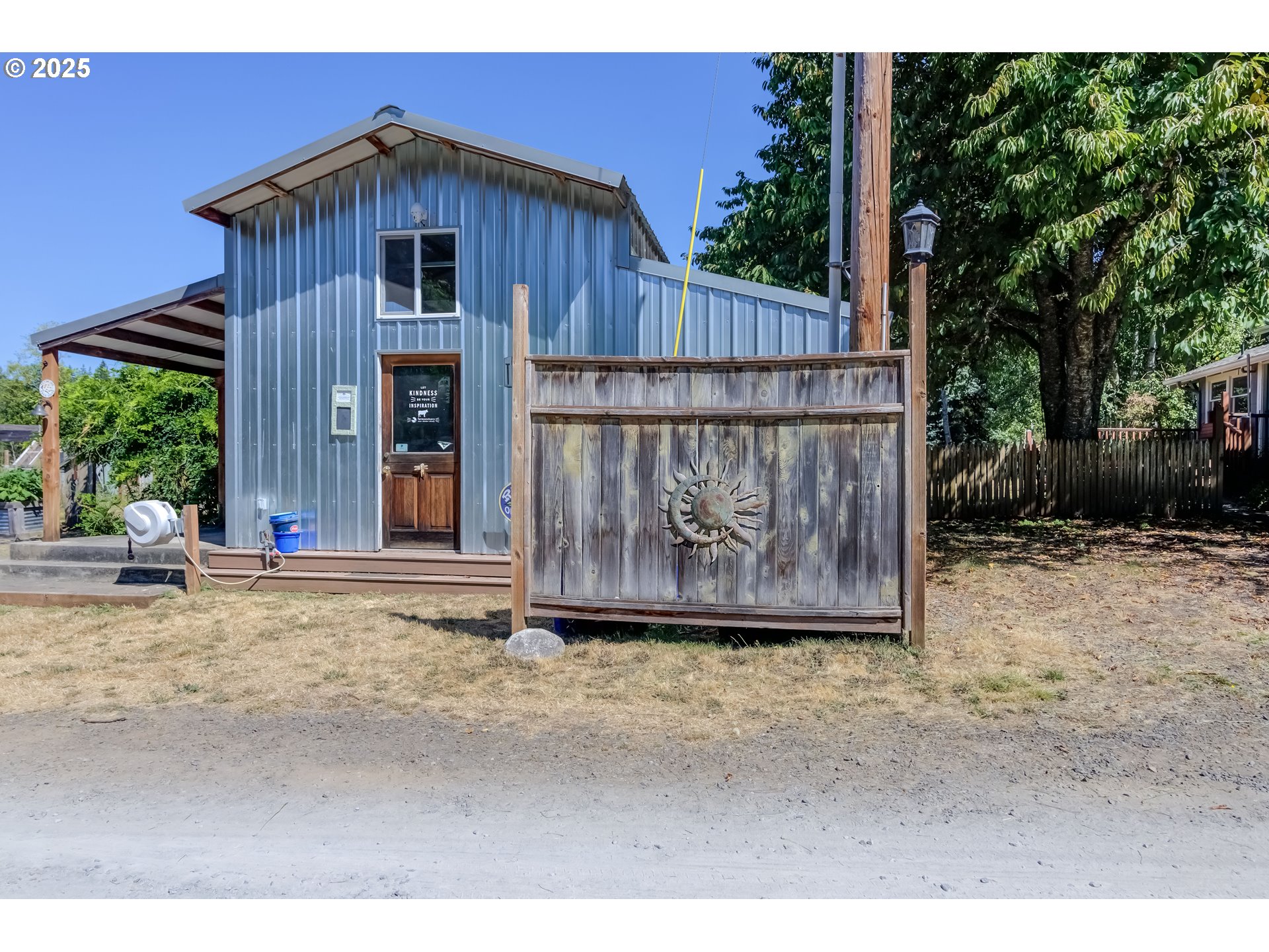 25113 South Ridge Road Beavercreek, OR 97004 - Photo 22 of 43 a wooden fence with some trees in the background