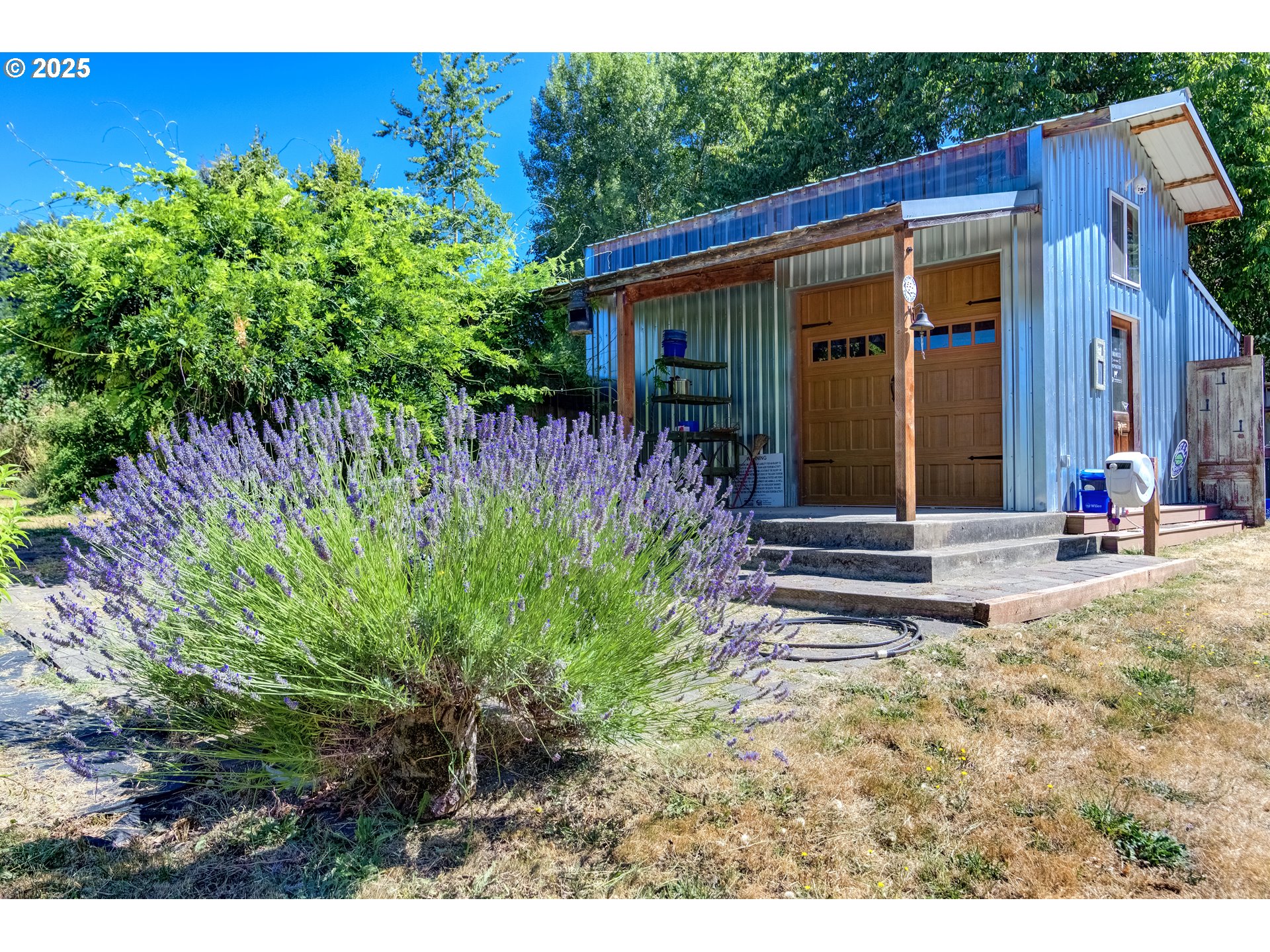 25113 South Ridge Road Beavercreek, OR 97004 - Photo 23 of 43 a view of a house with backyard and garden