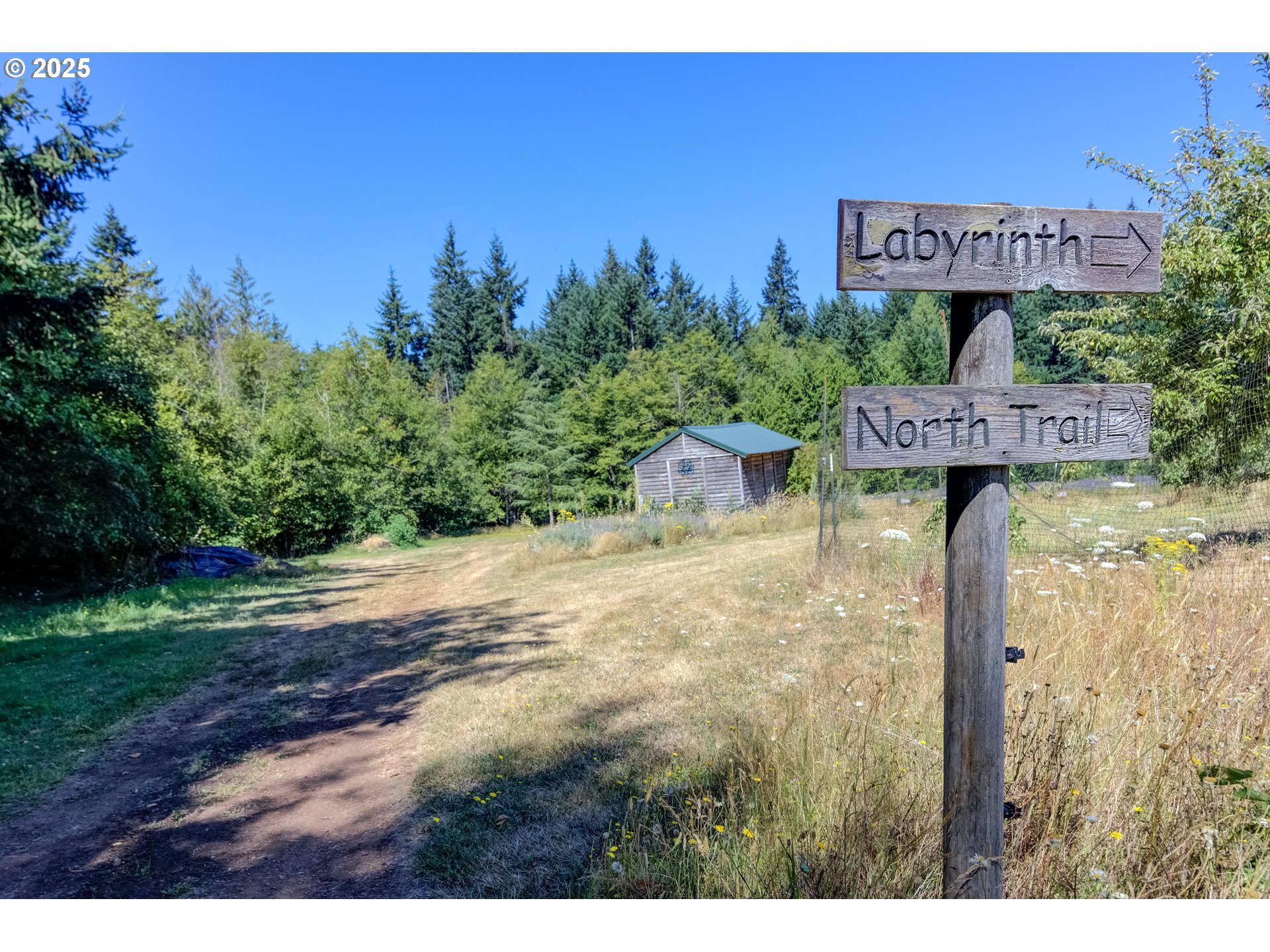 25113 South Ridge Road Beavercreek, OR 97004 - Photo 30 of 43 a view of a park with welcome board