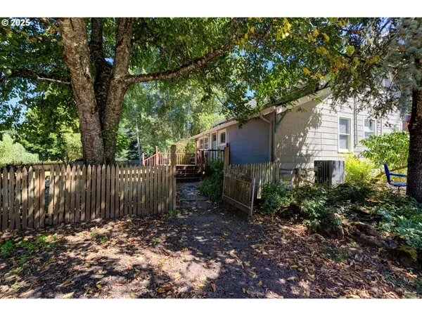 a backyard of a house with lots of green space
