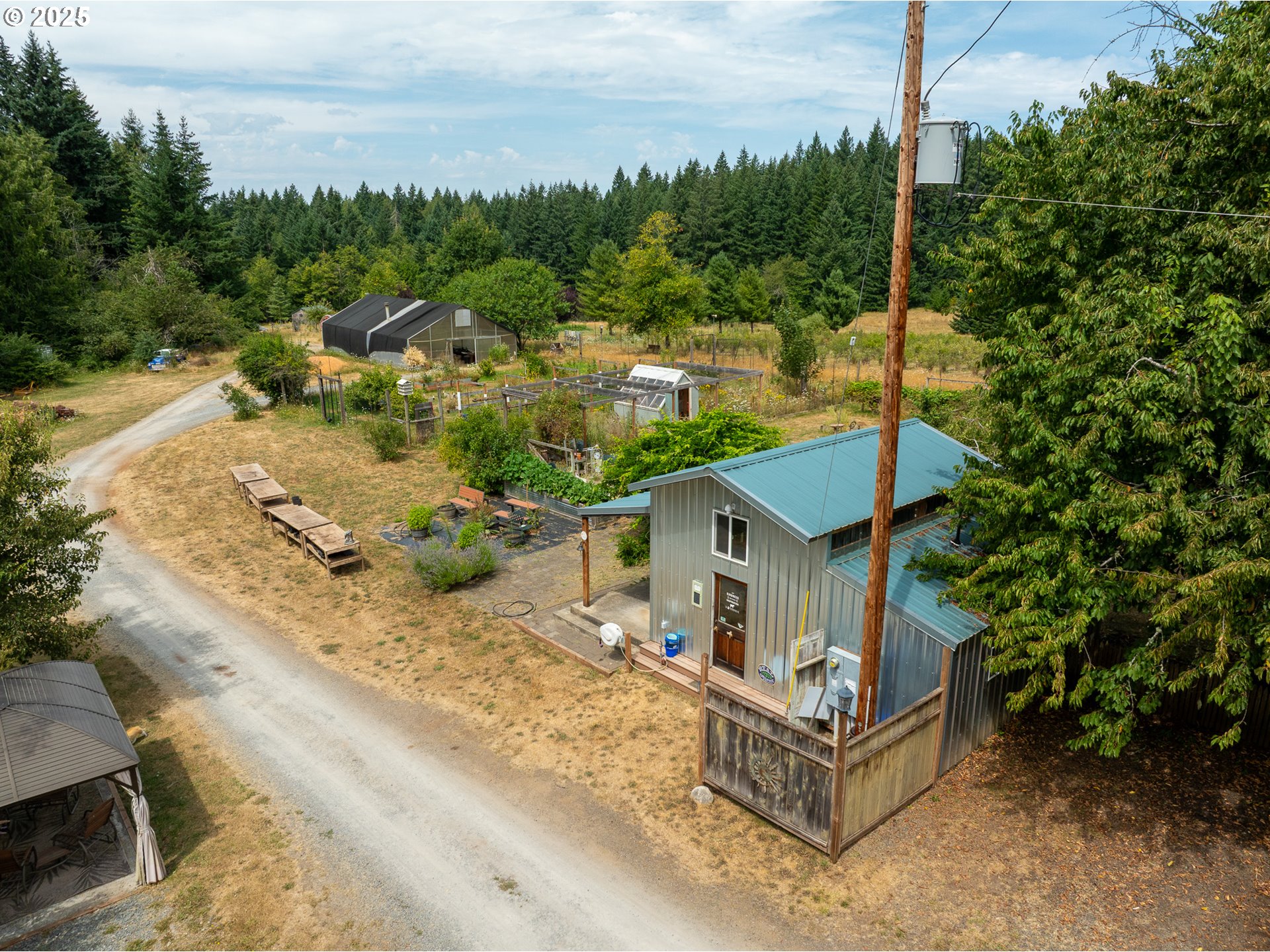 25113 South Ridge Road Beavercreek, OR 97004 - Photo 34 of 43 an aerial view of a house with a yard basket ball court and outdoor seating