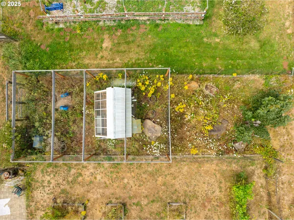 a view of a backyard with sitting area