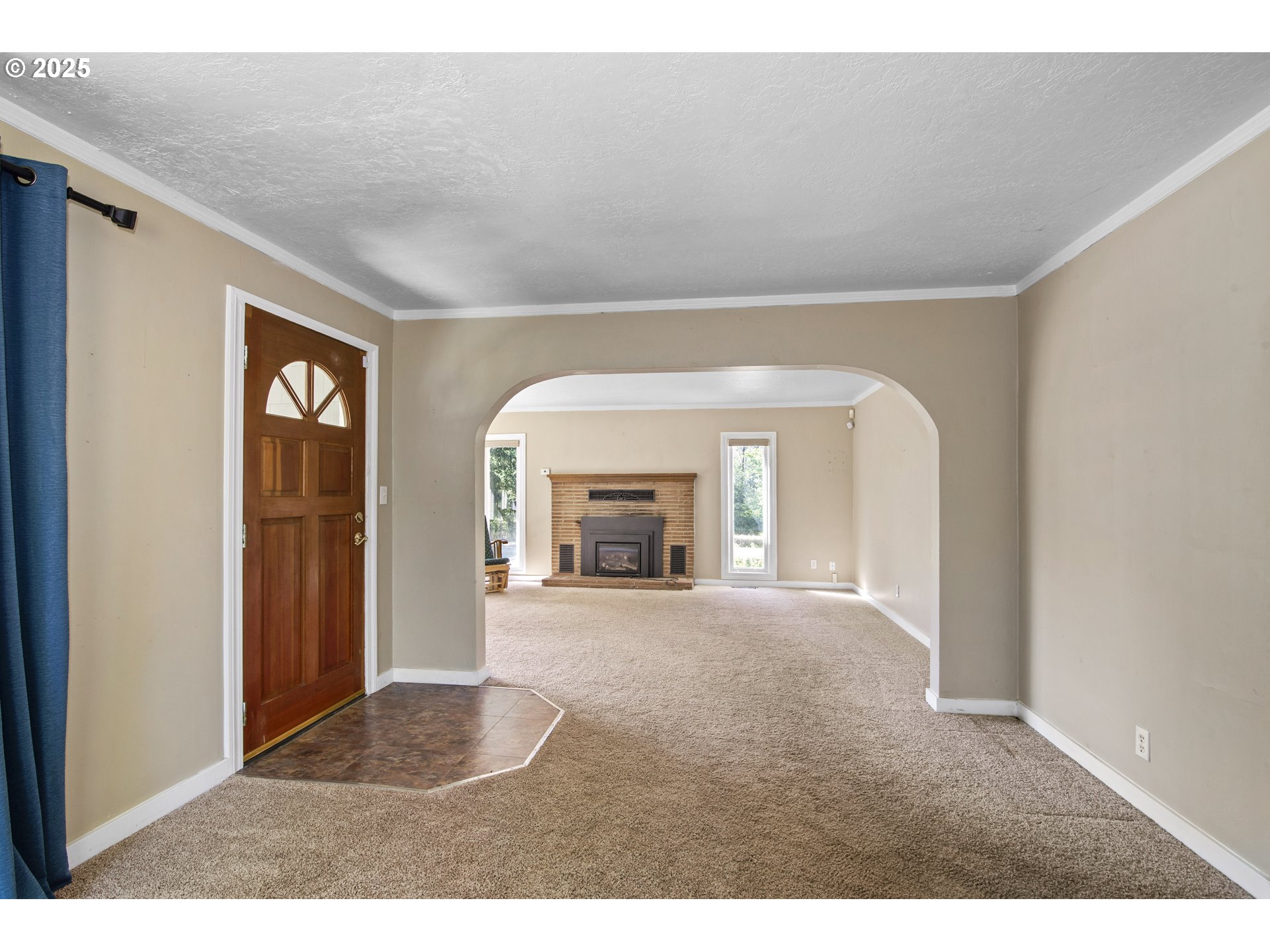 25113 South Ridge Road Beavercreek, OR 97004 - Photo 4 of 43 a view of an empty room with a fireplace