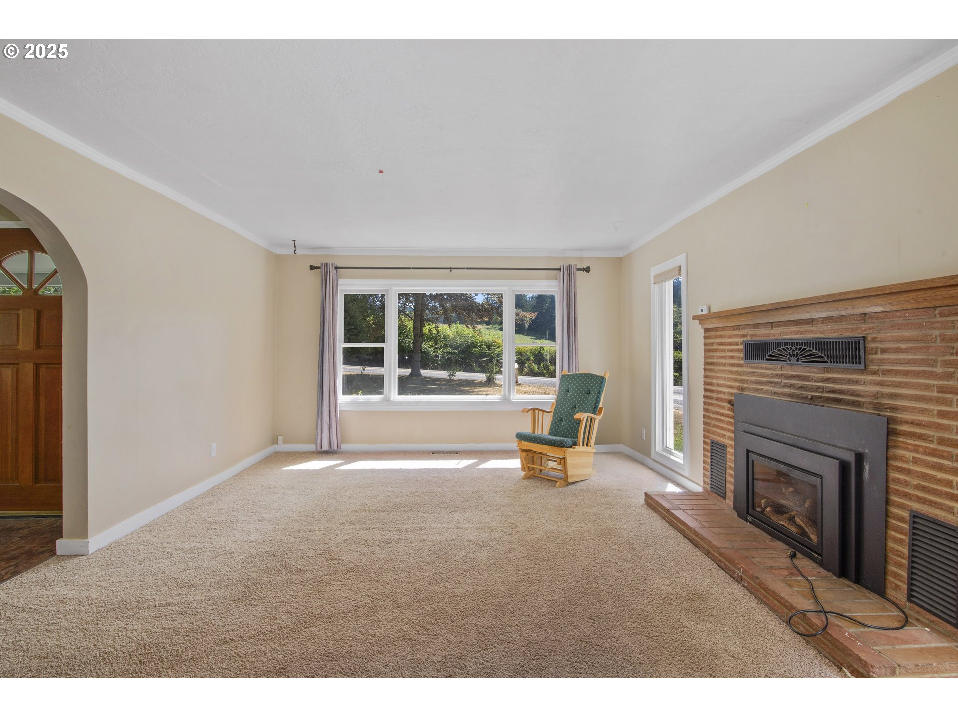 25113 South Ridge Road Beavercreek, OR 97004 - Photo 5 of 43 a living room with furniture and a fireplace