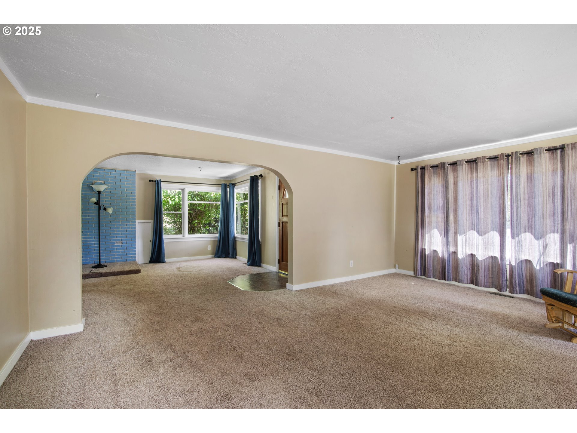 25113 South Ridge Road Beavercreek, OR 97004 - Photo 6 of 43 a view of an empty room with a fireplace