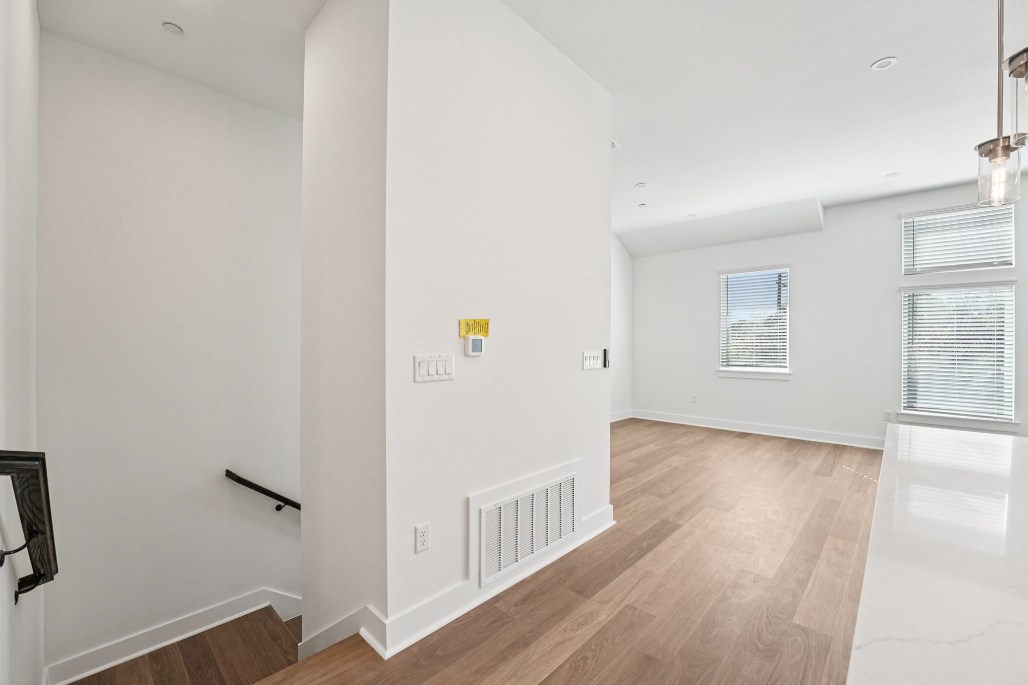 200 West 56th Street, Unit 5103 Austin, TX 78751 - Photo 11 of 29 a view of an empty room with wooden floor and a window