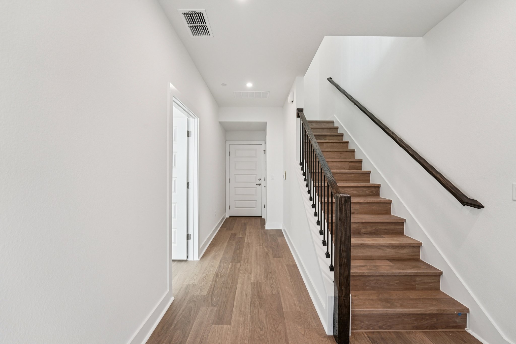 200 West 56th Street, Unit 5103 Austin, TX 78751 - Photo 13 of 29 a view of a hallway with wooden floor and entryway