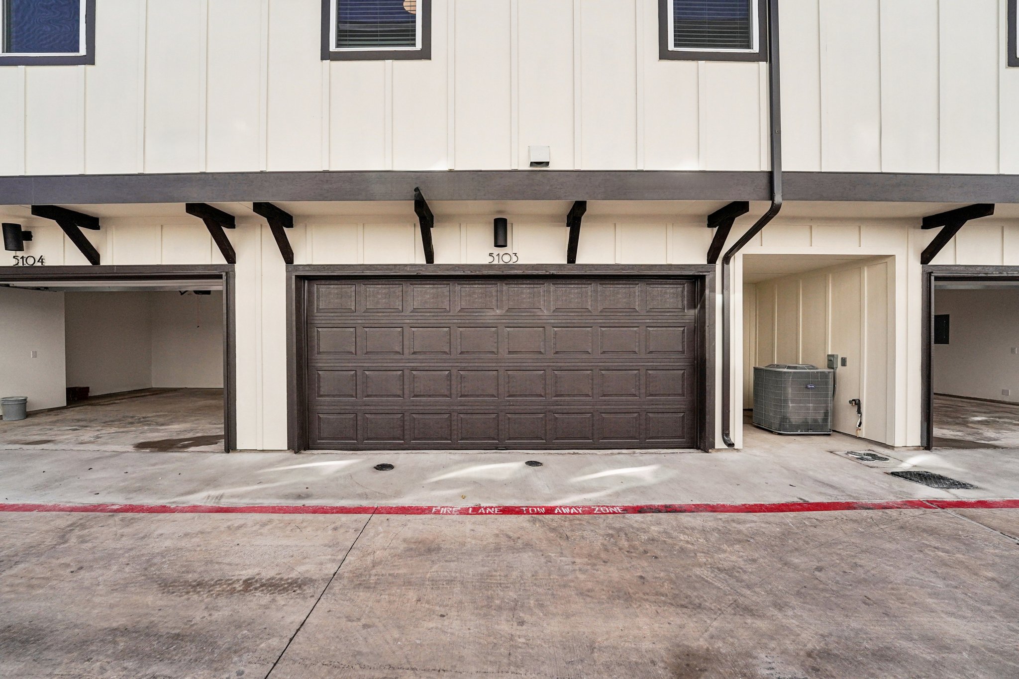200 West 56th Street, Unit 5103 Austin, TX 78751 - Photo 26 of 29 a front view of a house with garage