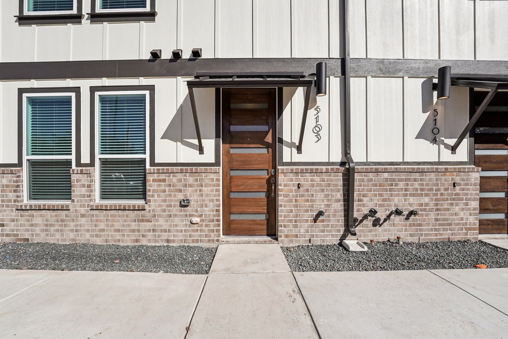 200 West 56th Street, Unit 5103 Austin, TX 78751 - Photo 28 of 29 a front view of a house with a yard