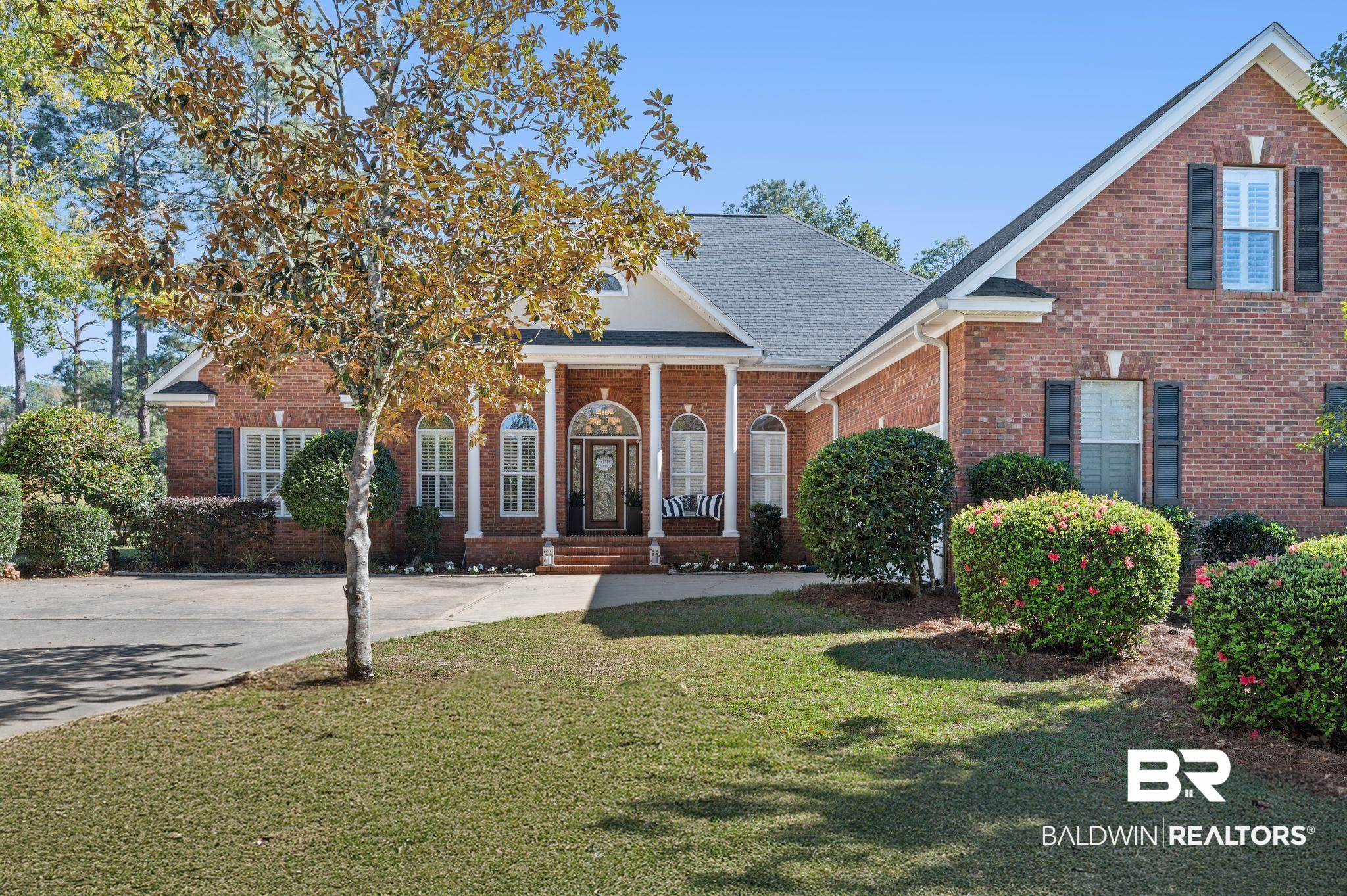 30151 Dolive Ridge Daphne, AL 36527 - Photo 1 of 37 View of front of home with a front lawn, brick siding, driveway, and a shingled roof