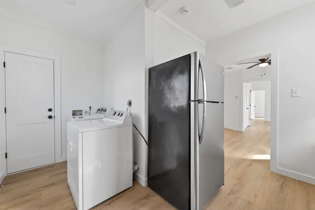 a view of a storage & utility room with a washer dryer