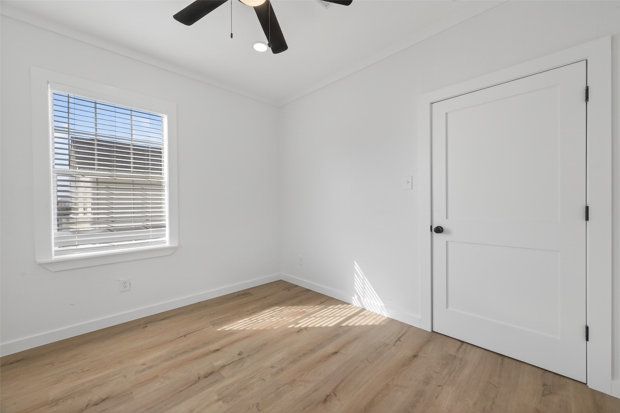2202 Hutchins Street, Unit C Houston, TX 77003 - Photo 13 of 27 a view of empty room with wooden floor and window