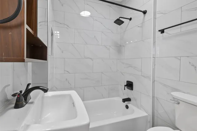 a bathroom with a sink and a bathtub