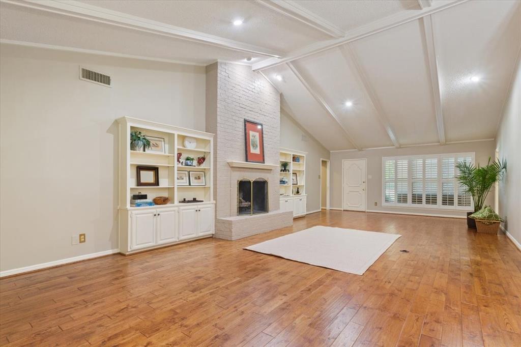 4108 Old Mill Road Waco, TX 76710 - Photo 10 of 39 Vaulted ceiling with exposed beams and recessed lighting