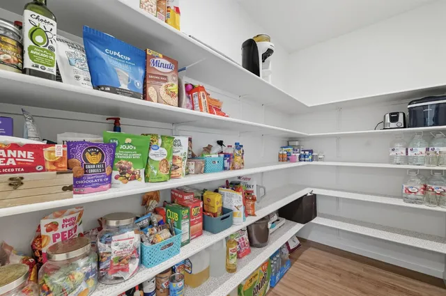 a utility room with lots of clutter and toys