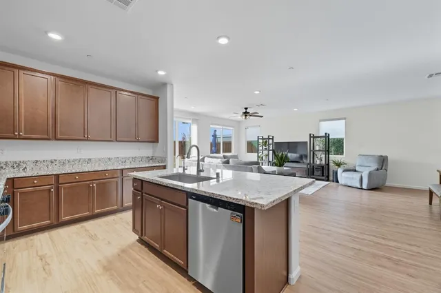 a kitchen with sink and cabinets