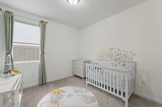 a room with furniture and white walls