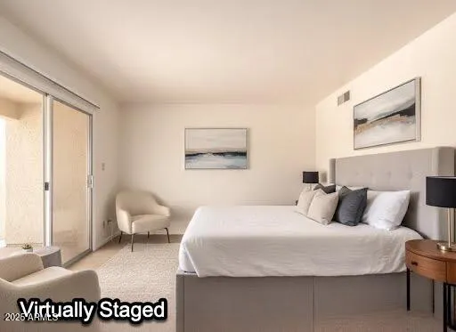 a bedroom with a bed and couch