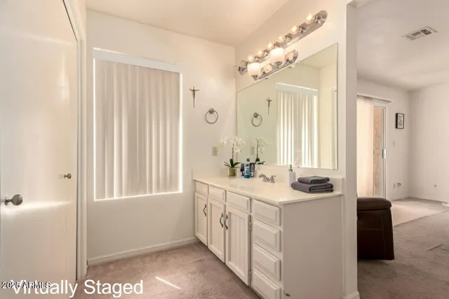 a bathroom with a sink a vanity and a mirror